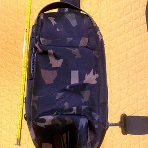 Camo sling bag with lock and USB port backpack